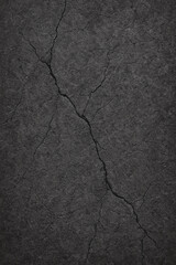 Obraz premium Cracked dark gray stone surface with deep fracture lines and rugged details, vintage grunge background for construction themes, retro design, and abstract projects. 