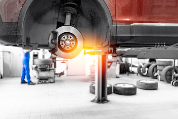 Car tires pile in garage service center or shop. Concept maintenance of auto, background with sunlight