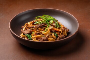 Stir-fried Tsuivan Noodles With Meat Served on Ceramic Plate
