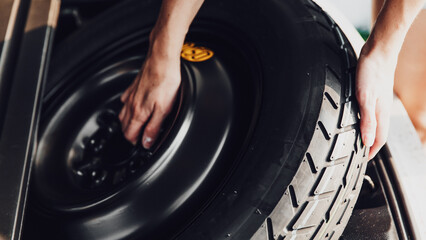 The process of replacing the wheel. The place where the spare wheel is stored in the trunk of the...