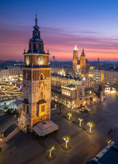 Town Hall Tower and St Marys Church over Main Square in Krakow, Poland, colorful sunrise