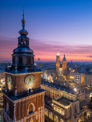 Town Hall Tower and St Marys Church over Main Square in Krakow, Poland, colorful sunrise