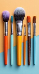 Colorful makeup brushes arranged on a pastel background