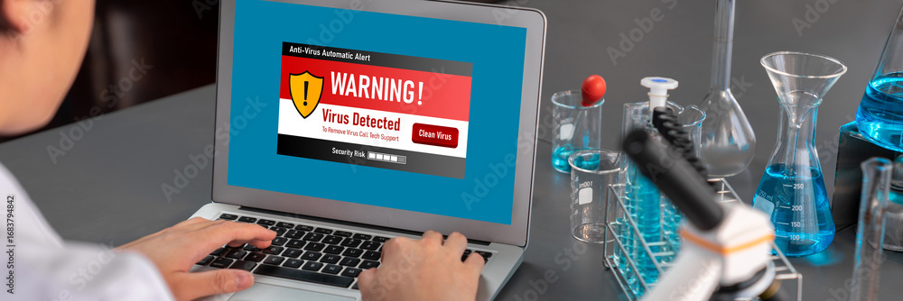 Poster virus warning alert on computer screen detected brisk cyber threat , hacker, computer virus and malw
