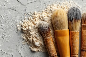 Makeup brushes and powder on textured surface