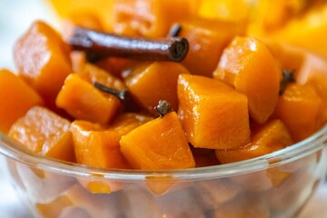 An ancient, vintage dessert known as pumpkin bricks in syrup, prepared with quicklime, cloves, and...