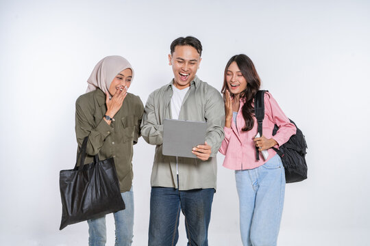 Three close friends share smiles and laughter while enjoying a moment together on a tablet - Powered by Adobe