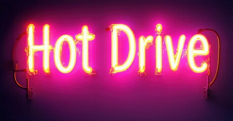 Obraz premium Bright neon sign displays words Hot Drive. Pink, yellow glow against dark background. Simple lettering, modern aesthetic.