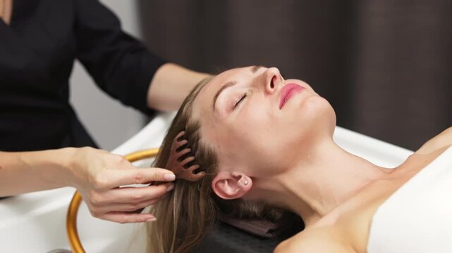 Young woman receiving a relaxing facial massage in a serene spa environment, with soothing lighting and natural elements enhancing the rejuvenating experience of facial care and wellness