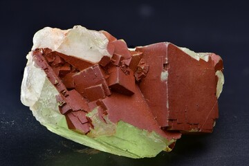 Green fluorite with iron oxides on quartz