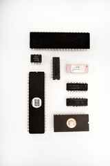 Several different chips on a white background. Old electronic chips.