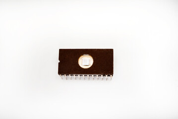 The microcircuit. An old microcircuit on a white background. An electronic device.