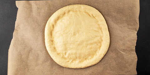 Raw pizza dough making pizza base tasty snack fresh delicious gourmet food background on the table rustic top view copy space