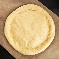 Raw pizza dough making pizza base tasty snack fresh delicious gourmet food background on the table...