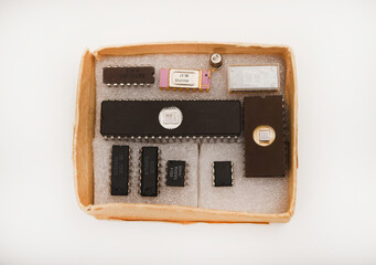 Several different chips on a white background. Old electronic chips.