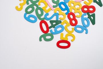 Bright wooden numbers on a colored background. Close-up of colorful wooden numbers back to school.