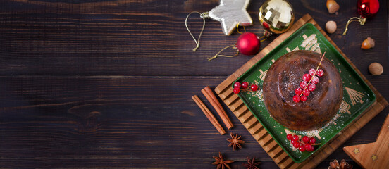 Fruit cake pudding traditionally served as part of Christmas dinner. High angle view with copy space