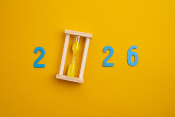 Colored numbers of the calendar for 2026 on the background. Happy New Year 2026 card.