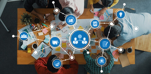 A vibrant team collaborates in a creative brainstorming session using visual tools, colorful notes, and coffee, fostering innovative ideas and strategic planning in an engaging environment. Amity