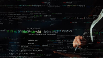 A close-up view of a person hand using a tablet while surrounded by floating lines of code,...