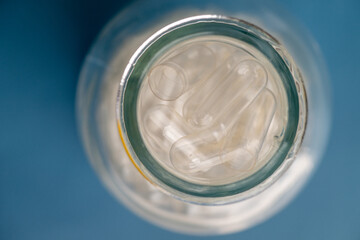 Abstract Background with Empty Transparent Capsules for Making Supplements