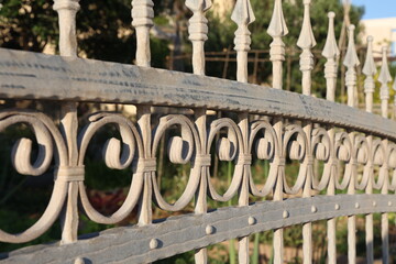 Metal curly fence in the park