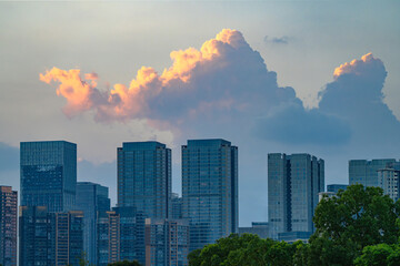 modern office building exterior in downtown financial district in Chengdu under dusk cloud