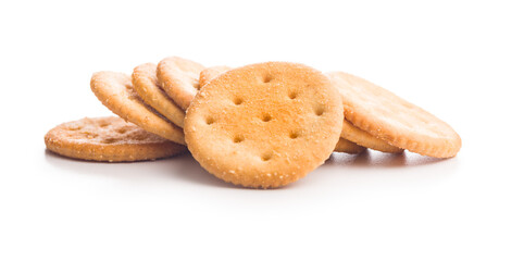 Crispy round salted crackers isolated on white background.