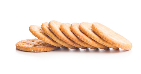 Crispy round salted crackers isolated on white background.