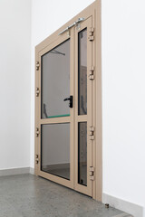 Modern fire door is reliable, functional entrance to public or administrative building. Beige fire...