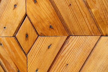 Wooden boards on the door.Wood paneling of the walls.Parquet board.