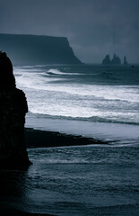 waves on black sand beach in southern Iceland at Vik seen from Dyrhólaey Lighthouse