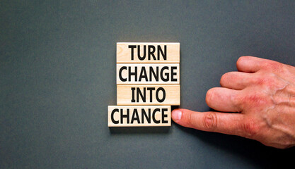 Turn change into chance symbol. Concept words phrase Turn change into chance on beautiful wooden...