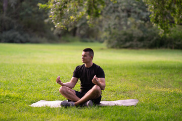 Fototapeta premium Man meditating outdoors