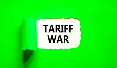 Trade tariff war symbol. Concept word Tariff war on beautiful white paper. Beautiful green paper...