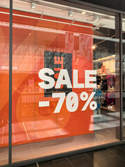 Exciting sale announcement displayed in vibrant colors at a shopping center