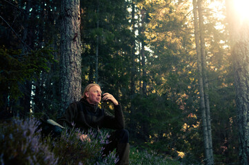 Man Relaxing in Sunlit Forest