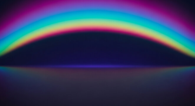 Vibrant rainbow arc reflecting on dark surface