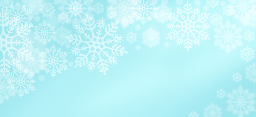 Delicate white snowflakes against a soft blue background celebrating winter's beauty