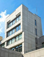 Modern building facade against a clear sky