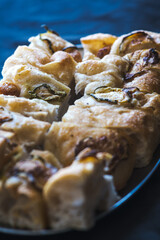 Freshly baked focaccia bread slices with golden crust and airy texture on a tray
