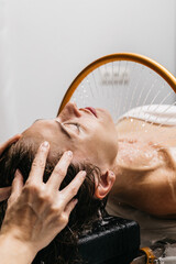Woman enjoying hydromassage therapy with soothing water jets, relaxing in a serene spa environment, experiencing rejuvenating aqua massage for ultimate relaxation and wellness