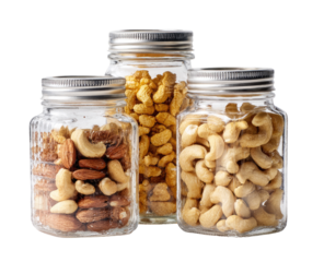Three glass jars filled with different nuts.  Small, square jar contains almonds and cashews.  Medium jar contains cashews.  Large jar contains more cashews.  All with metal lids.  Isolated on black