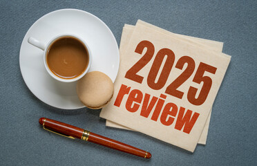 2025 year review text on napkin with coffee, business and personal reflection concept
