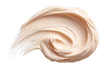 Light peach-colored cosmetic cream smear, swirled in a circular motion, with visible brush strokes