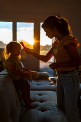 Young mother lecturing her daughter for not listening