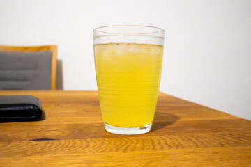 glass of lemonade on wooden table