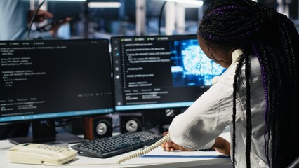 Data center admin receiving phone call, using AI assistant to provide user technical support....