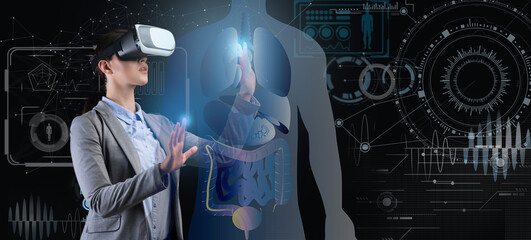 A healthcare professional engages with virtual reality technology to explore human anatomy and medical data. This innovative approach enhances understanding and training in modern medicine.