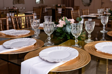 elegant dining room set up for a wedding or event, luxurious reception hall with a decorative tree, beautiful and sophisticated table setting for a celebration, cozy and romantic interior for a specia